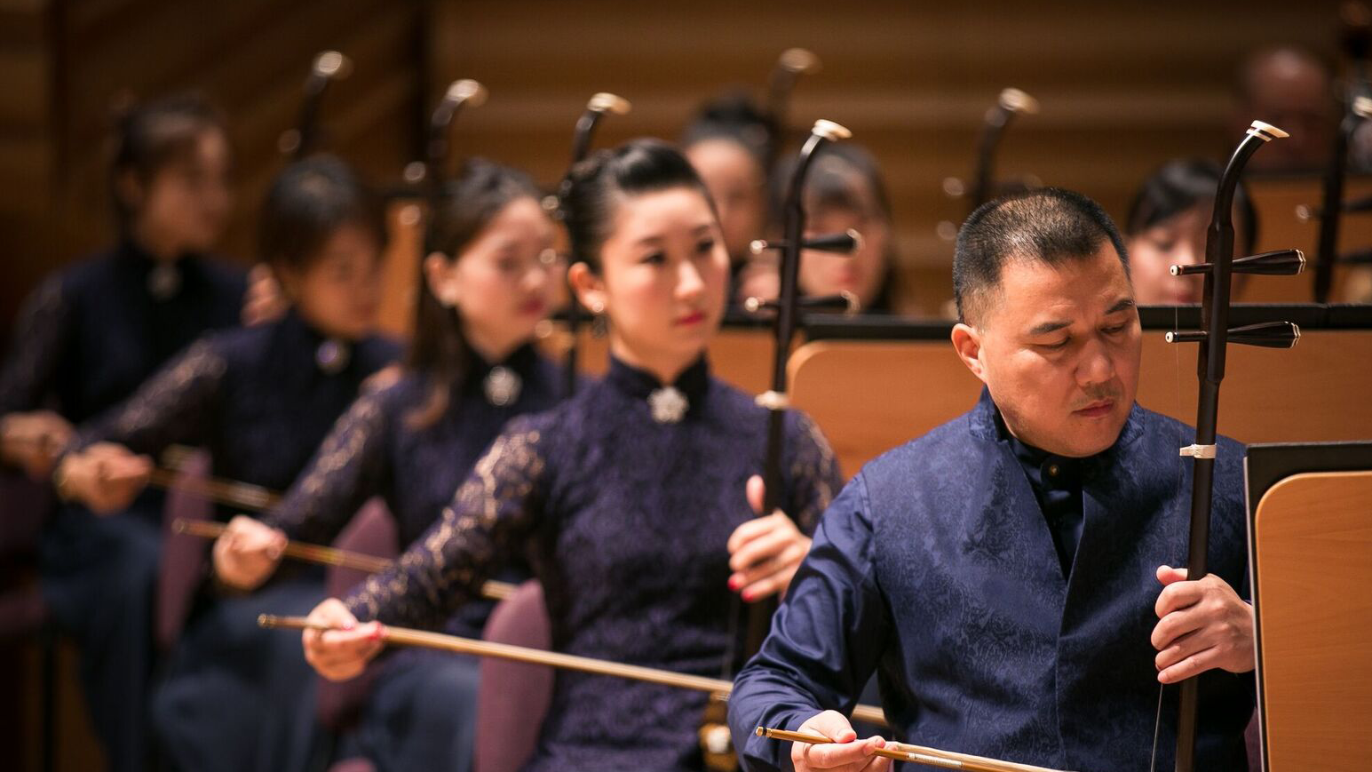 Muhai Tang conducts the Shanghai Chinese Orchestra in a colorful